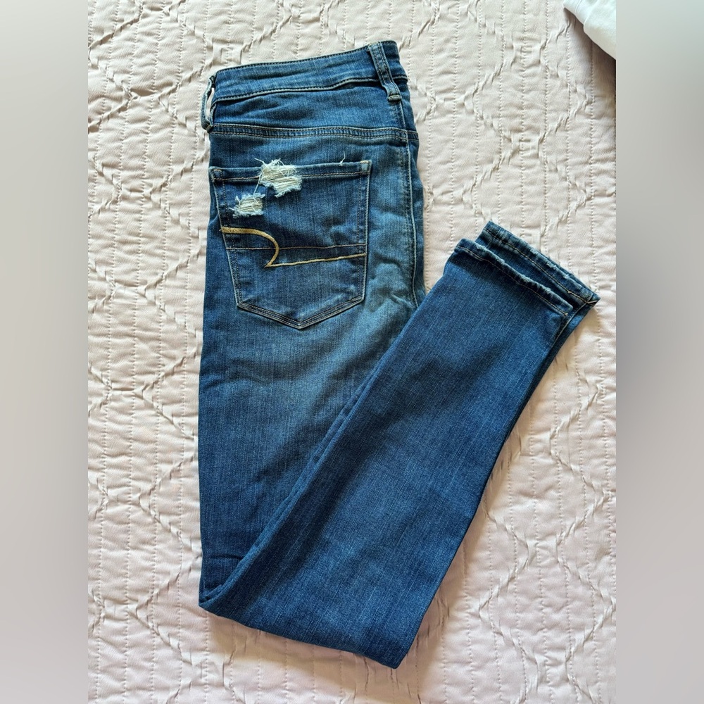 American Eagle Outfitters Distressed Skinny Jeans with Patches.